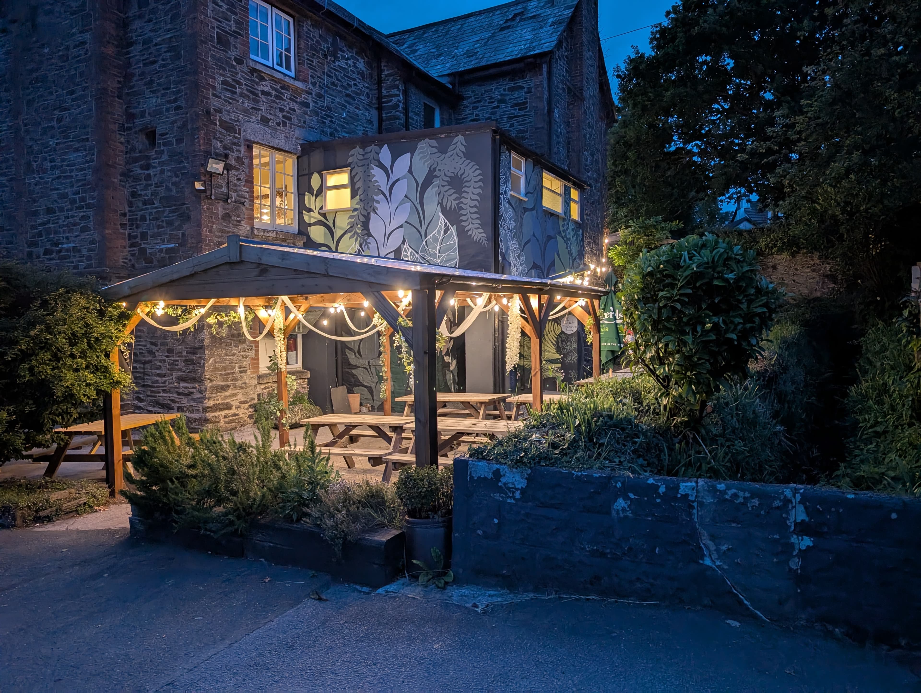 Beer garden at dusk with warm festoon lighting