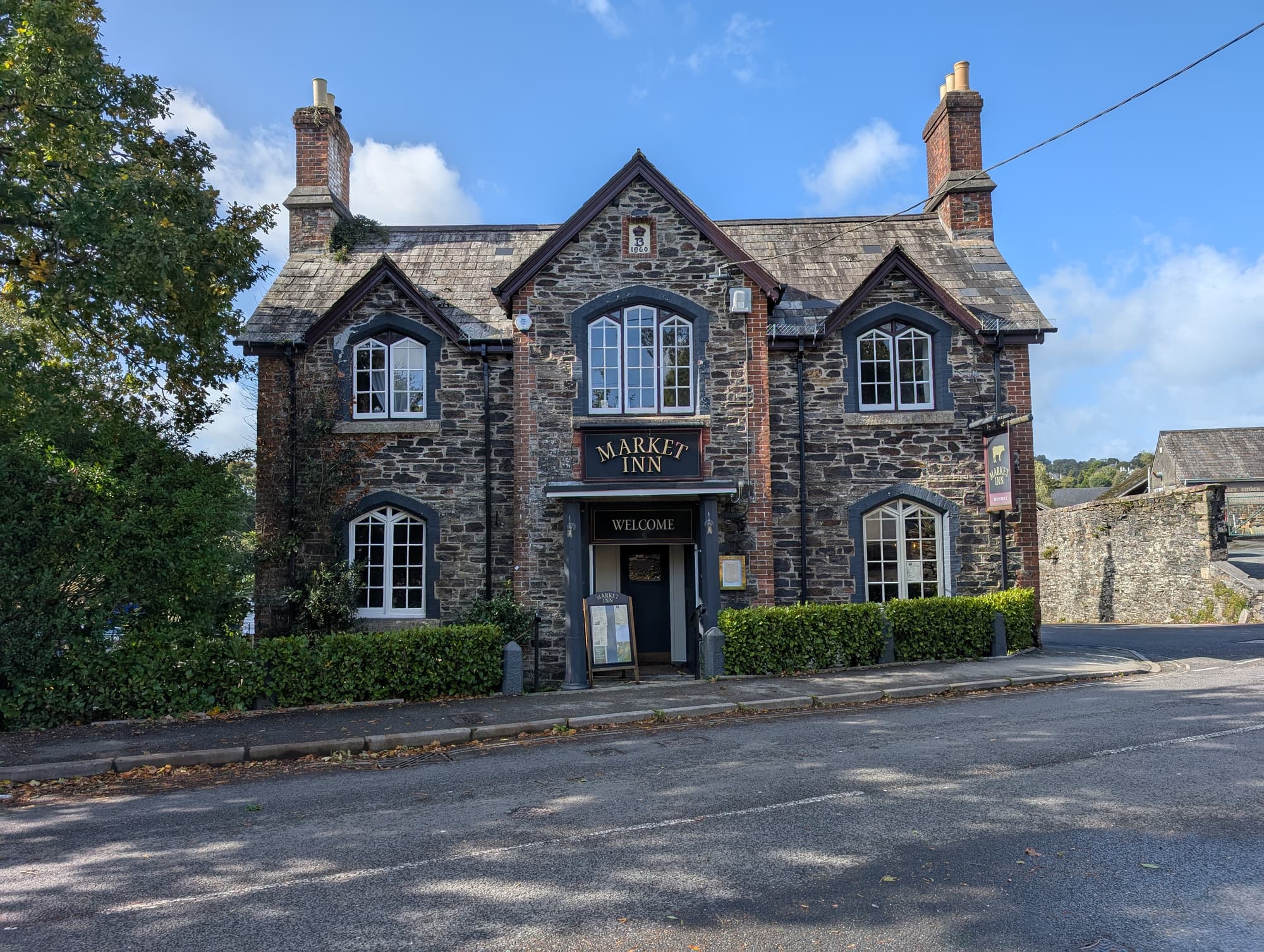 Front view of the Market Inn in Tavistock with stone exterior.